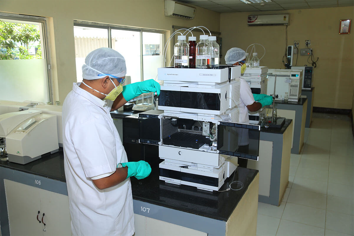 Researcher recording observations while mixing chemicals